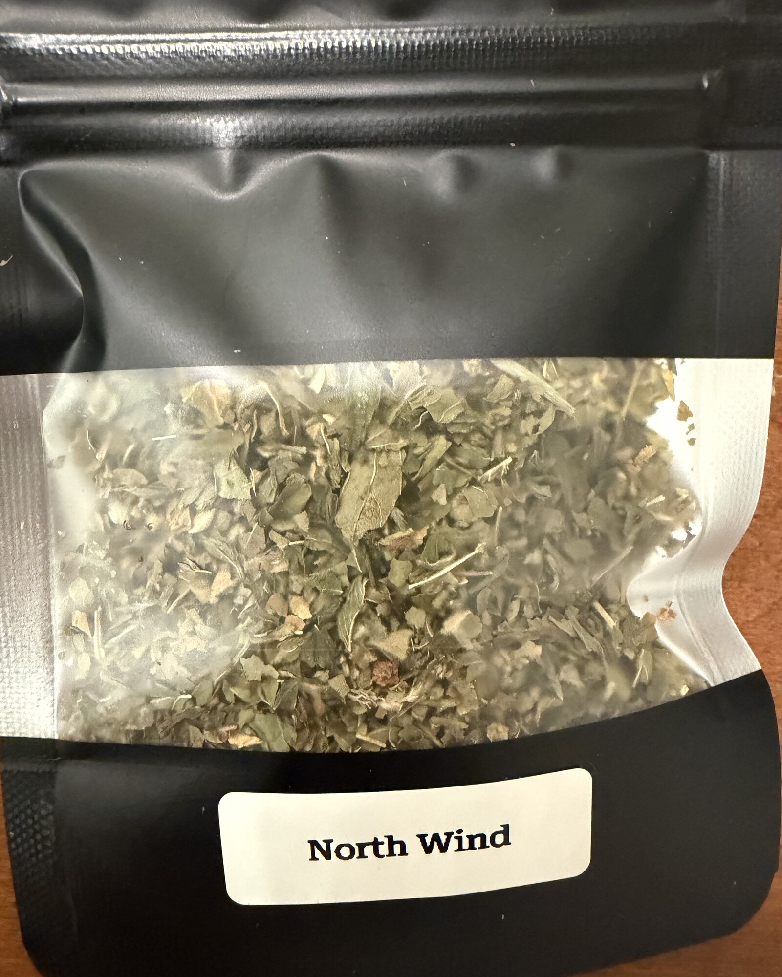 North Wind — close-up of the loose herb blend through the window of its pouch