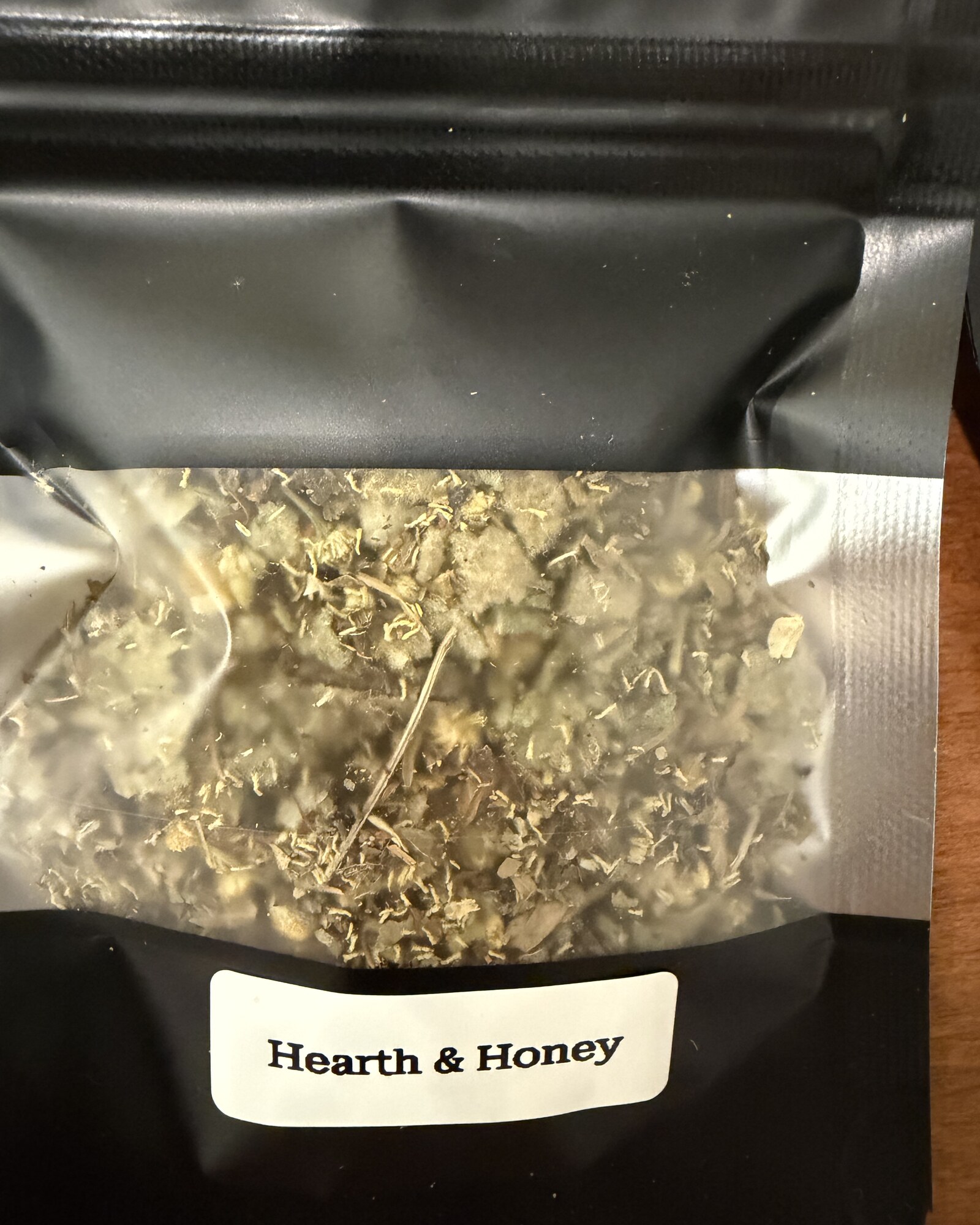 Hearth & Honey — close-up of the loose herb blend through the window of its pouch